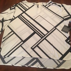 Chico’s black and white split arm top.